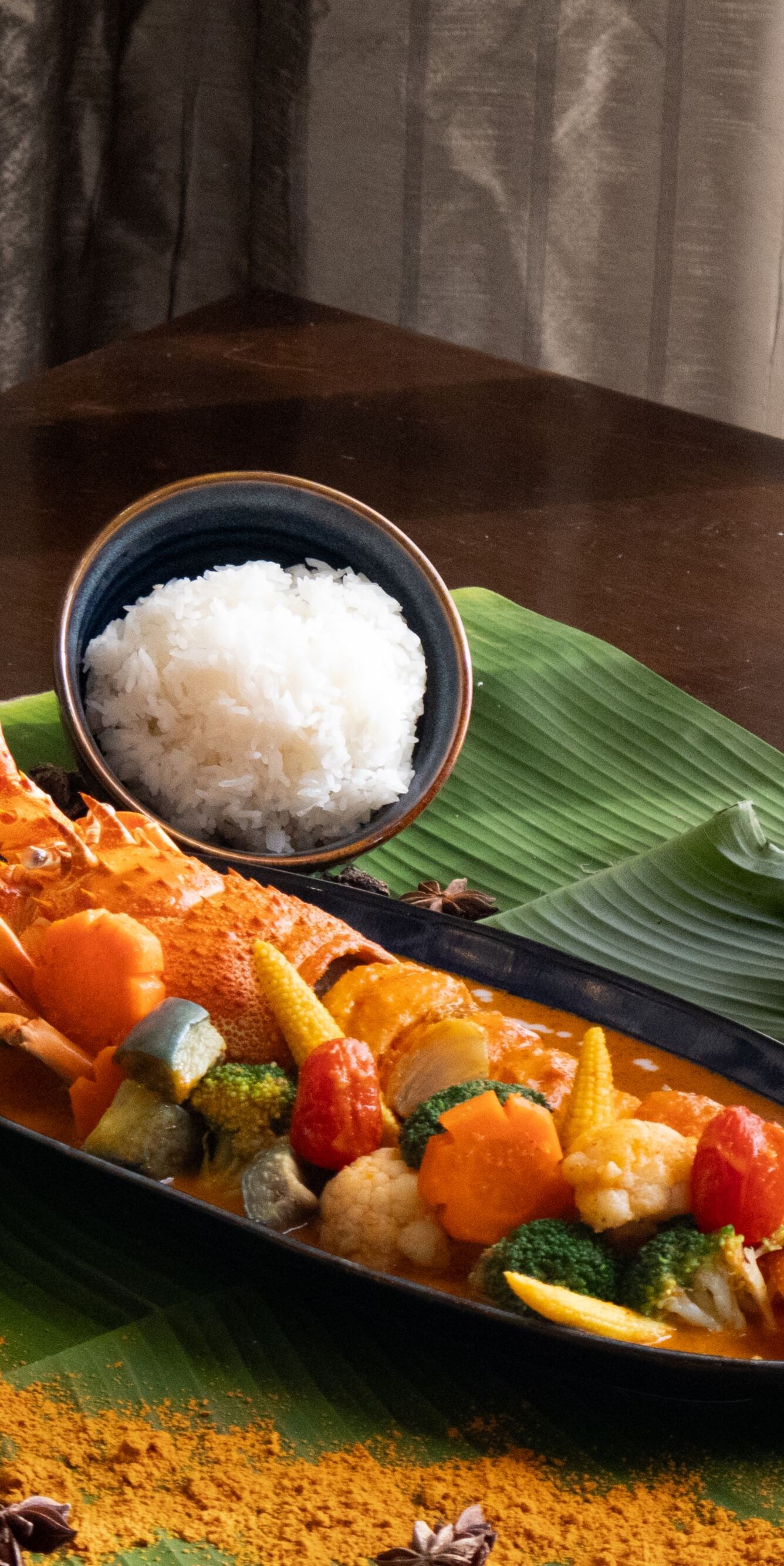Lobster curry with rice and fresh greens