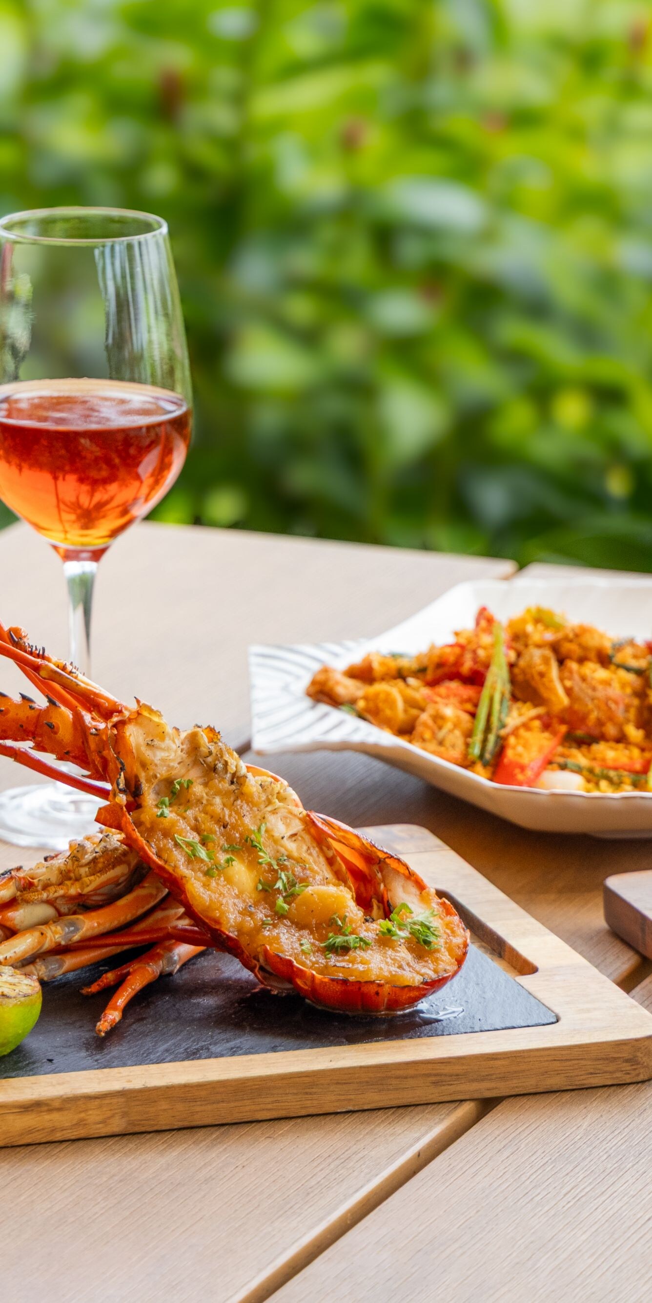 Gourmet lobster and fish with rose wine