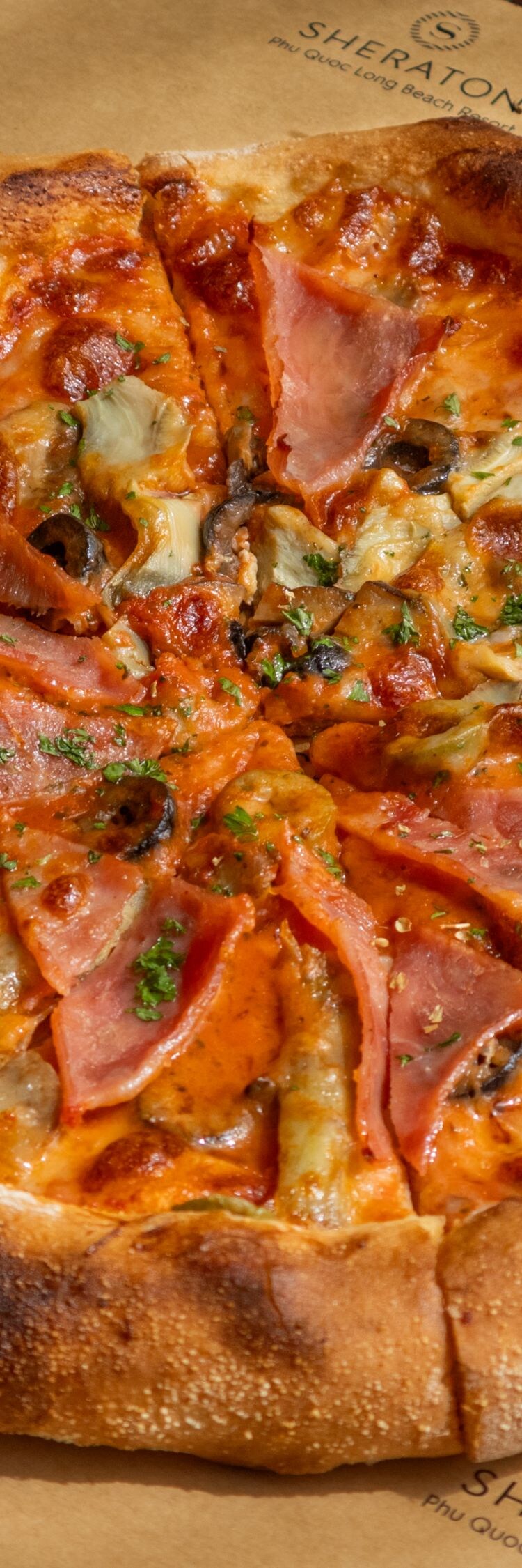Artisanal pizza with ham and olives
