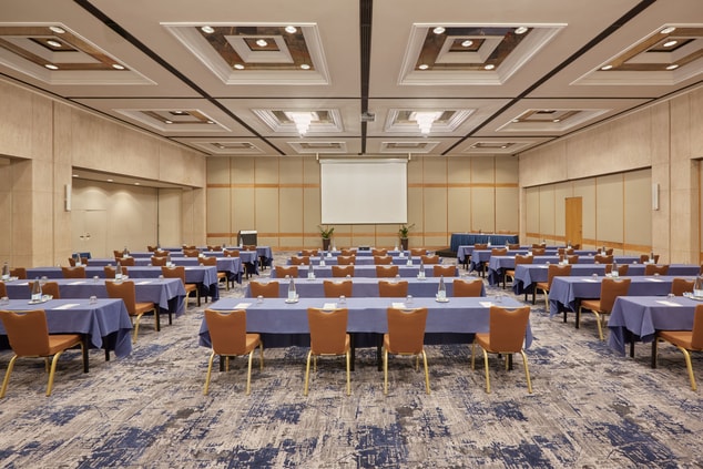 A large ballroom in schoolroom set up