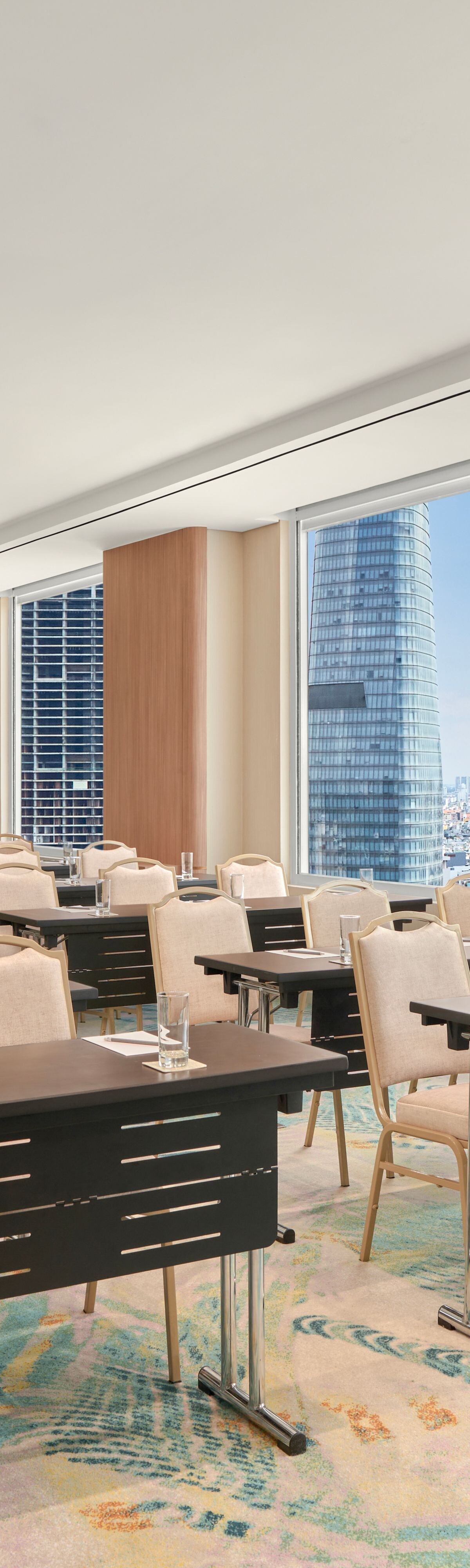 Classroom-style meeting room with city views