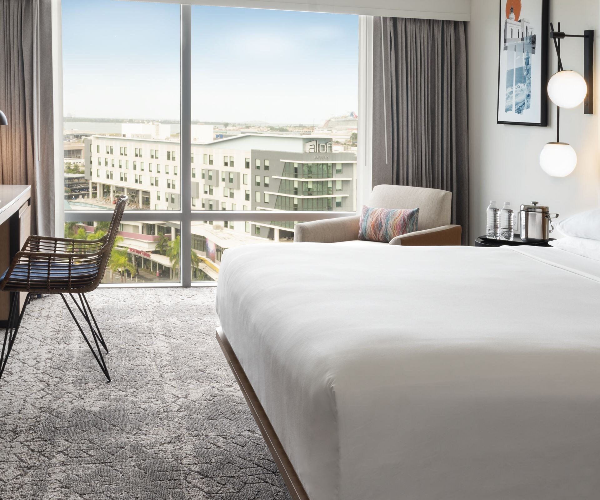 Hotel guest room with city view.