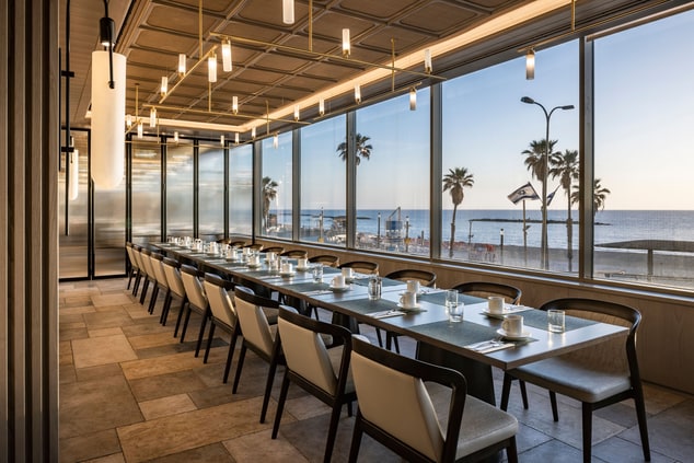 Long table for big company with sea view