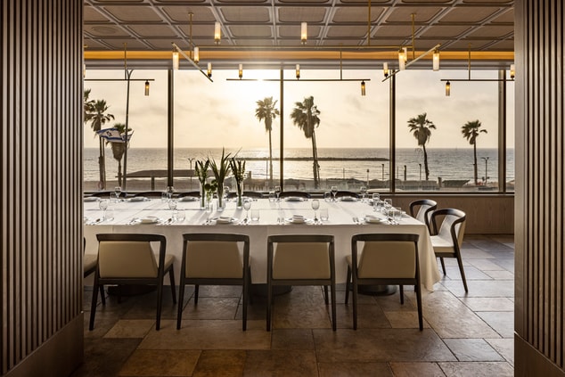 Long table at restaurant with a sea view