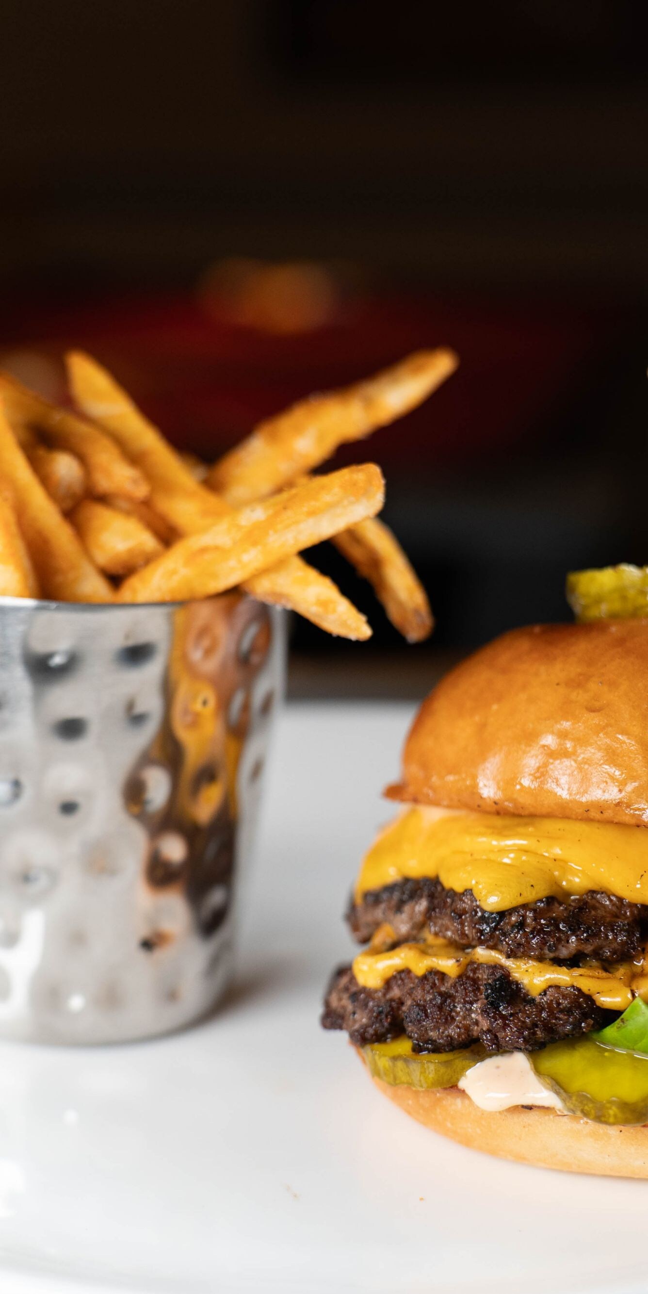 Double cheeseburger with pickles and fries