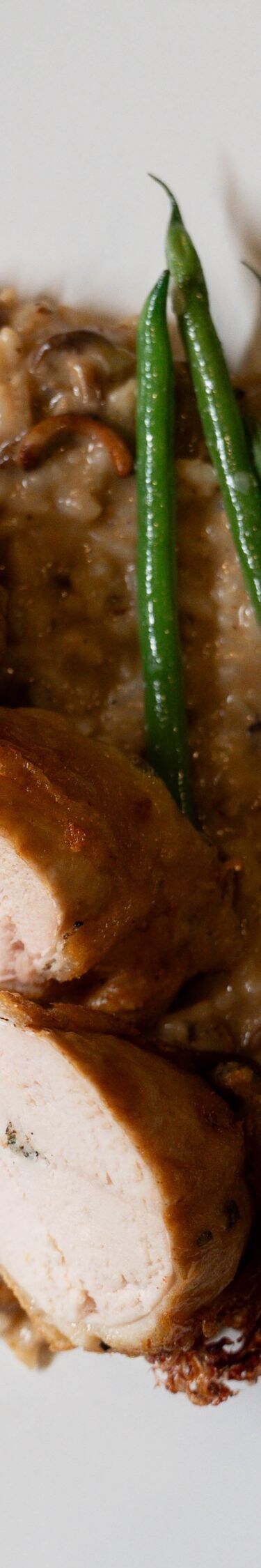 Chicken roulade with risotto and green beans
