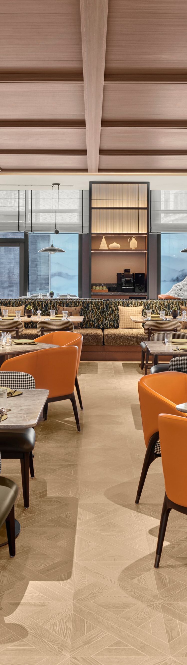 Restaurant with orange chairs and tables