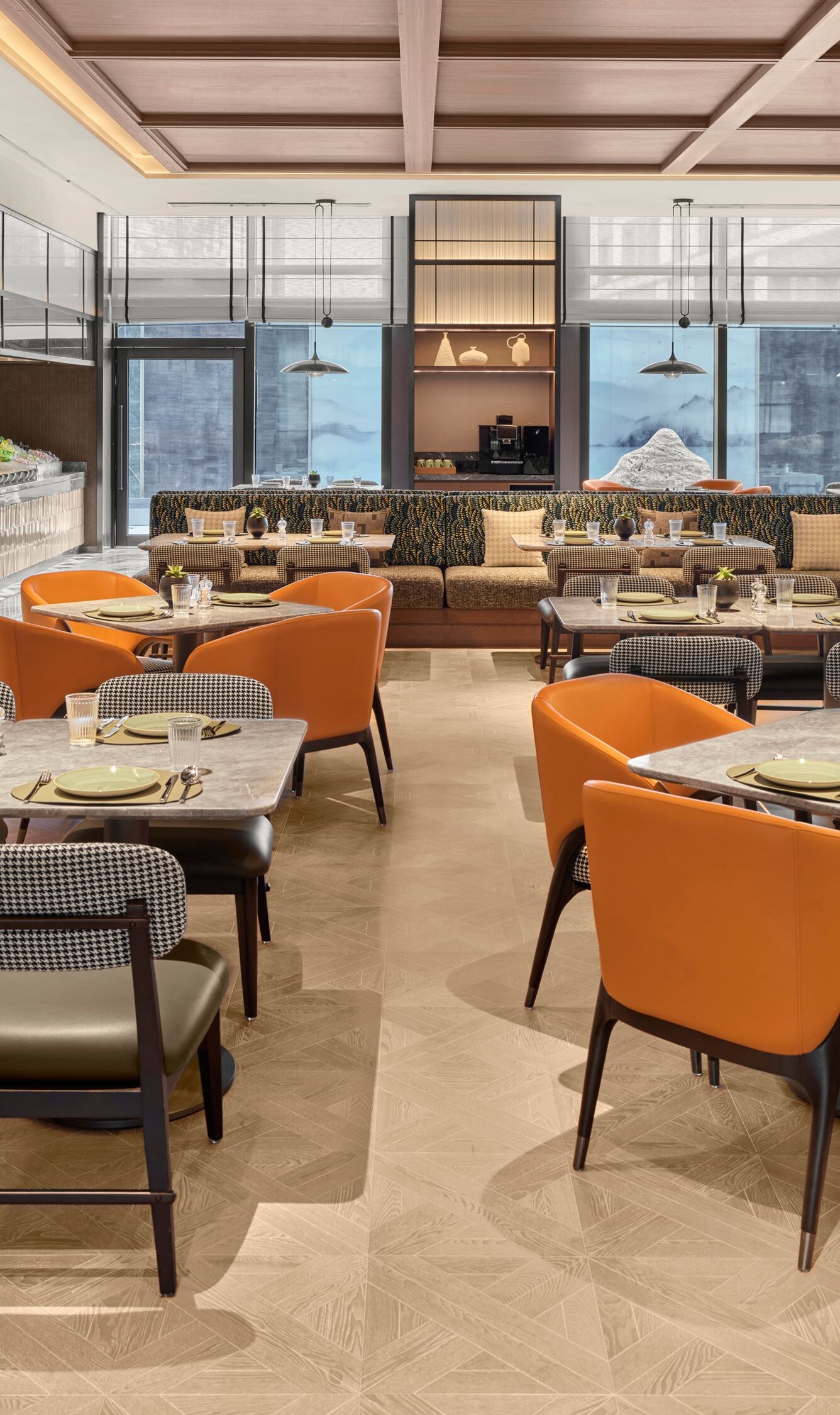 Restaurant with orange chairs and tables