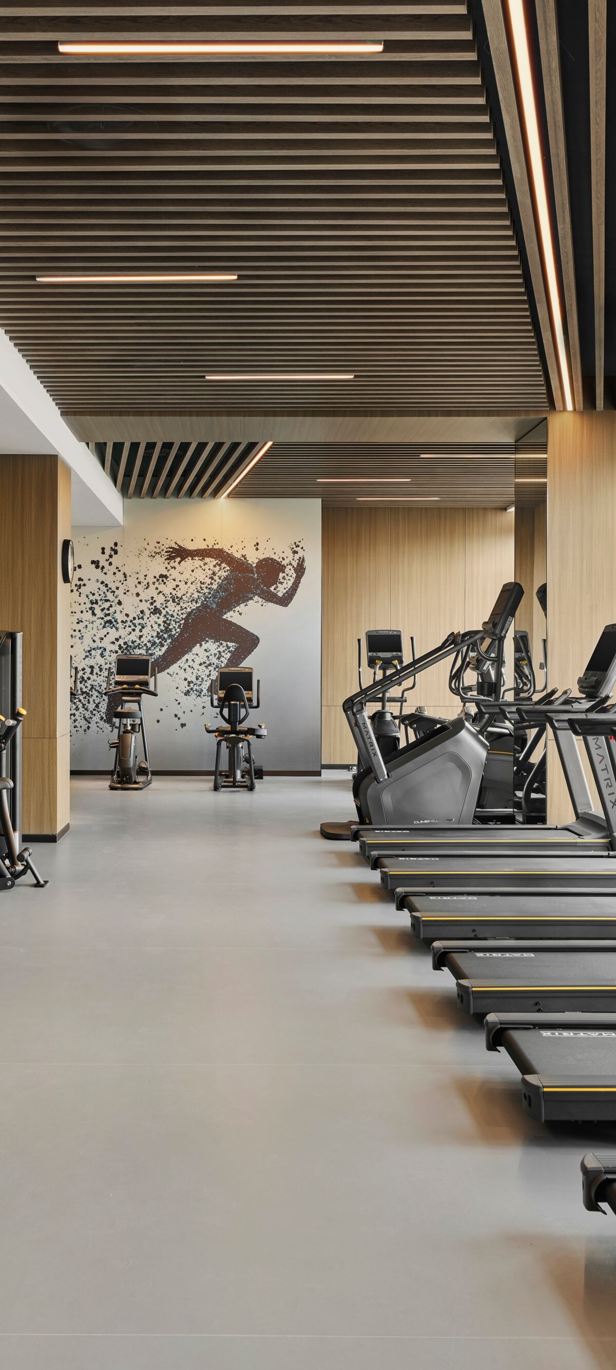 Fitness center with treadmills and city view