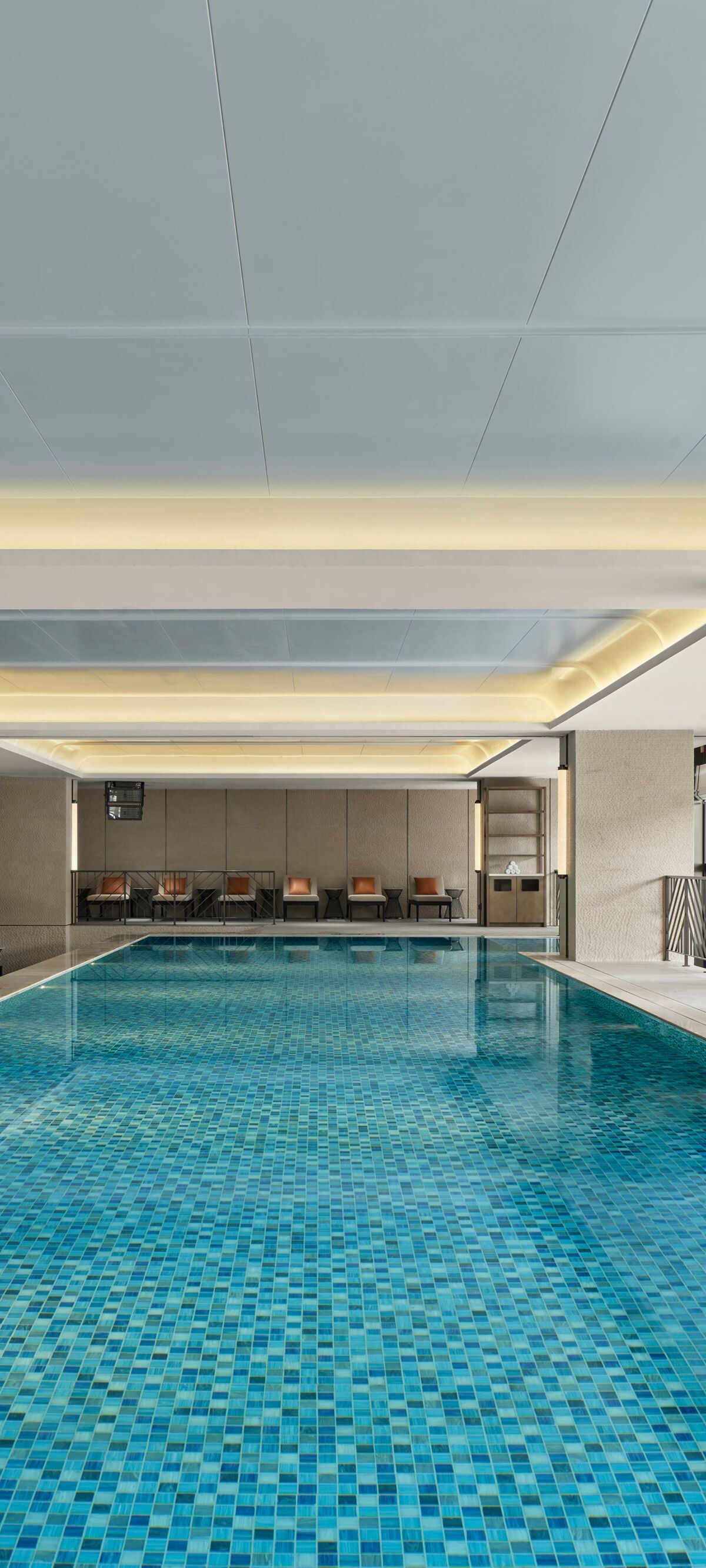 Indoor pool with modern design and lighting