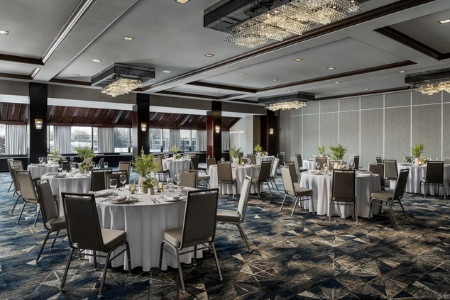 Banquet space with windows, dinner setup