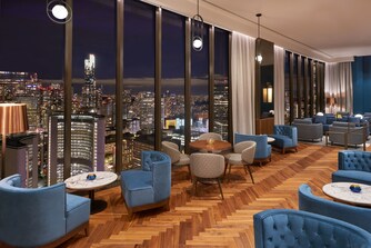 Intimate seating overlooking city at night