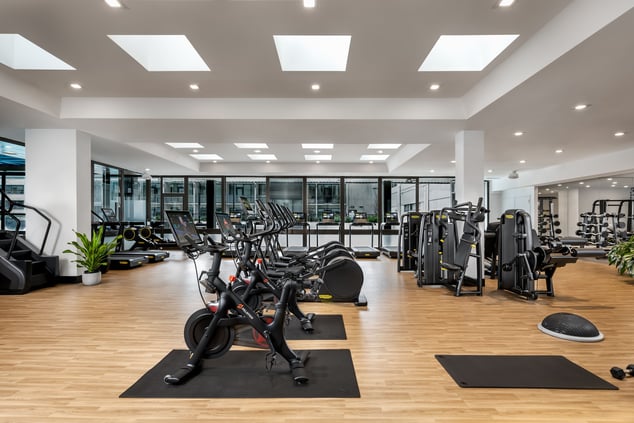 peloton bikes and other workout equipment in gym
