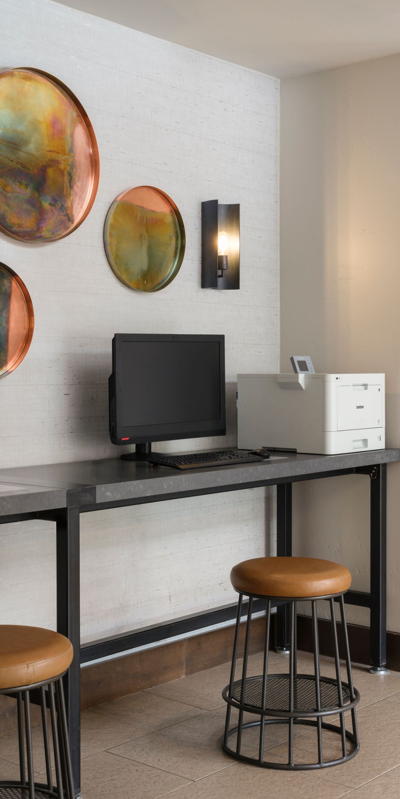 Desk with two computers, printer