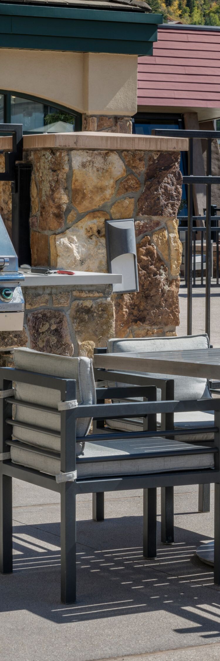 Two outdoor grills, picnic table