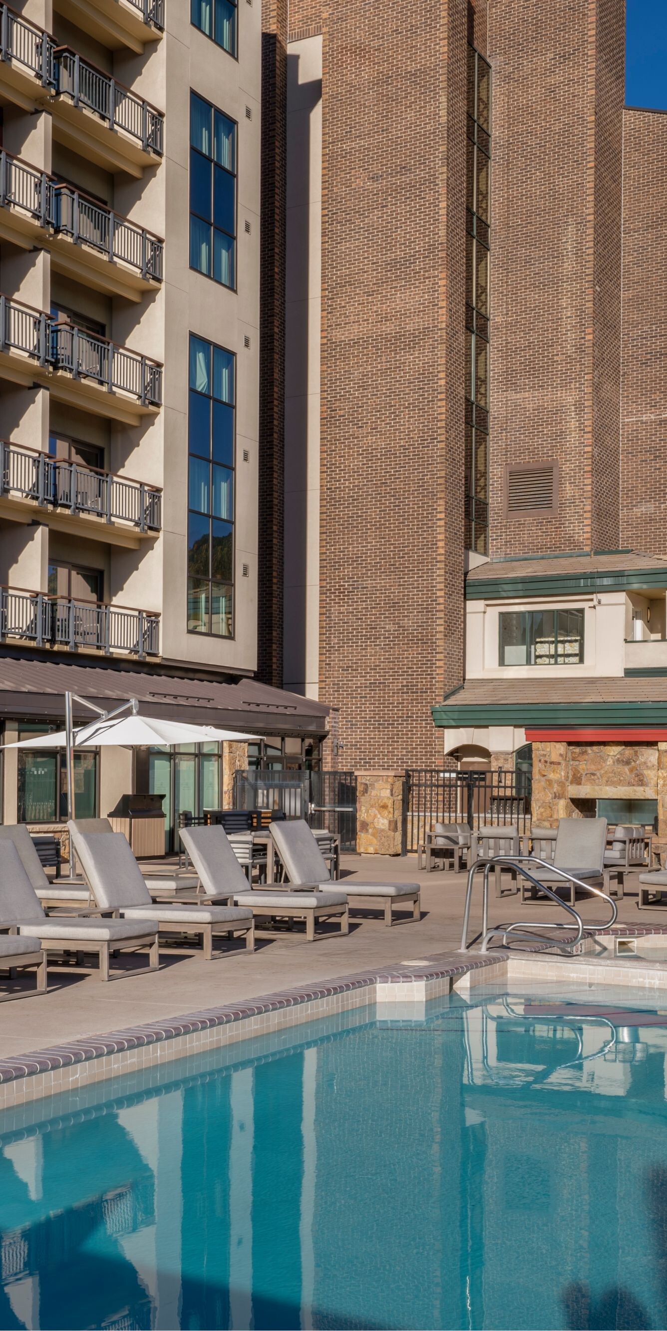 Outdoor pool, loungers, view of mountains