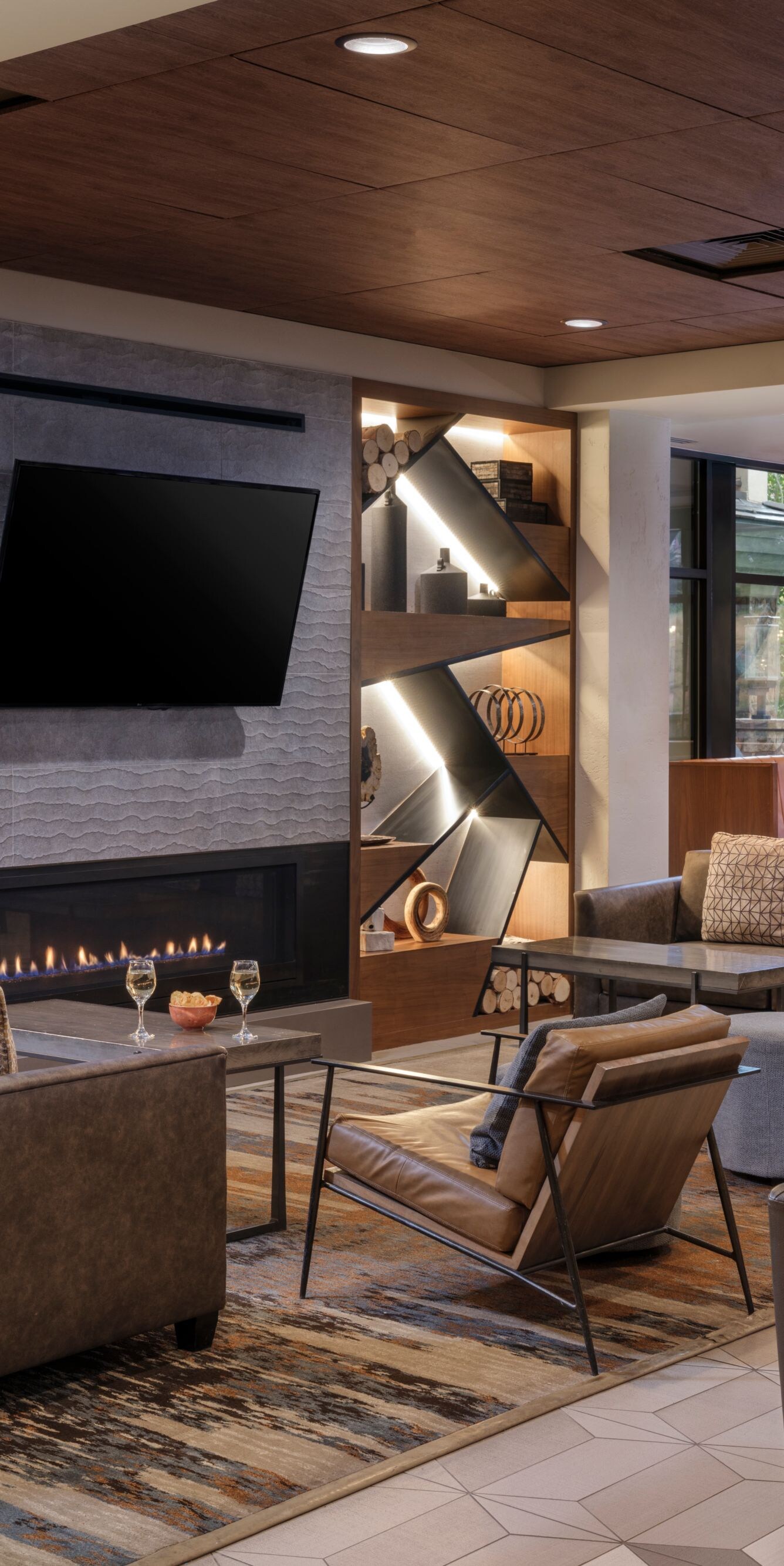 Lounge seating area, fireplace, TV on wall