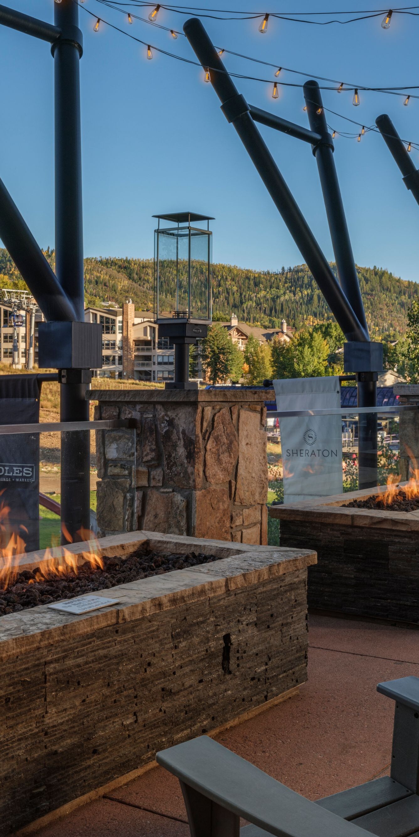 Outdoor seating area with fire pits, mountain view