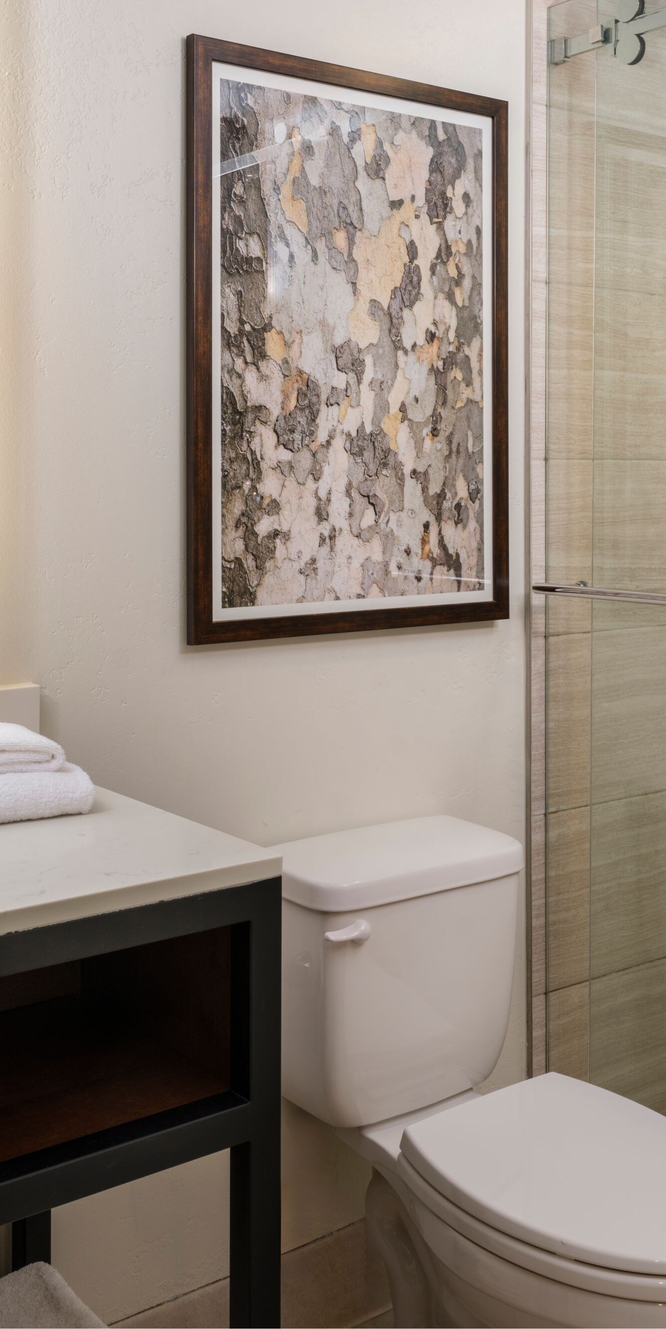 Vanity, walk-in shower, towels