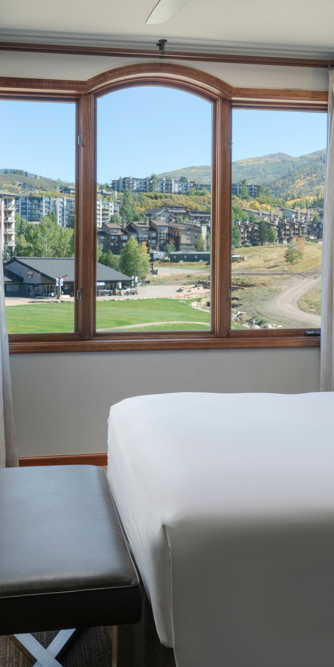 Queen bed, TV, view of resort area