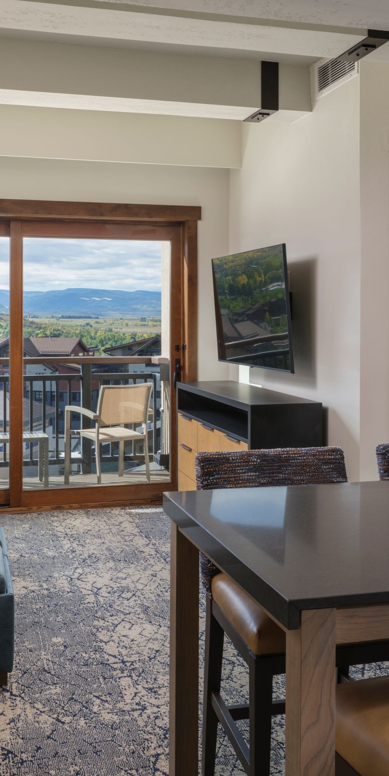 Living seating area, dining table, balcony
