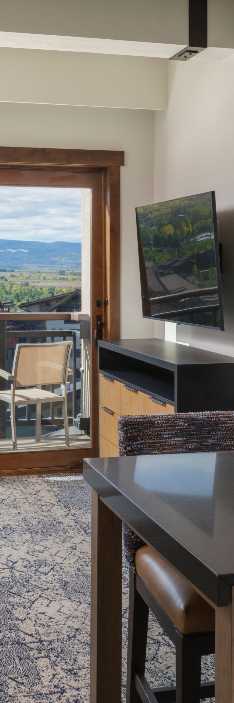 Living seating area, dining table, balcony