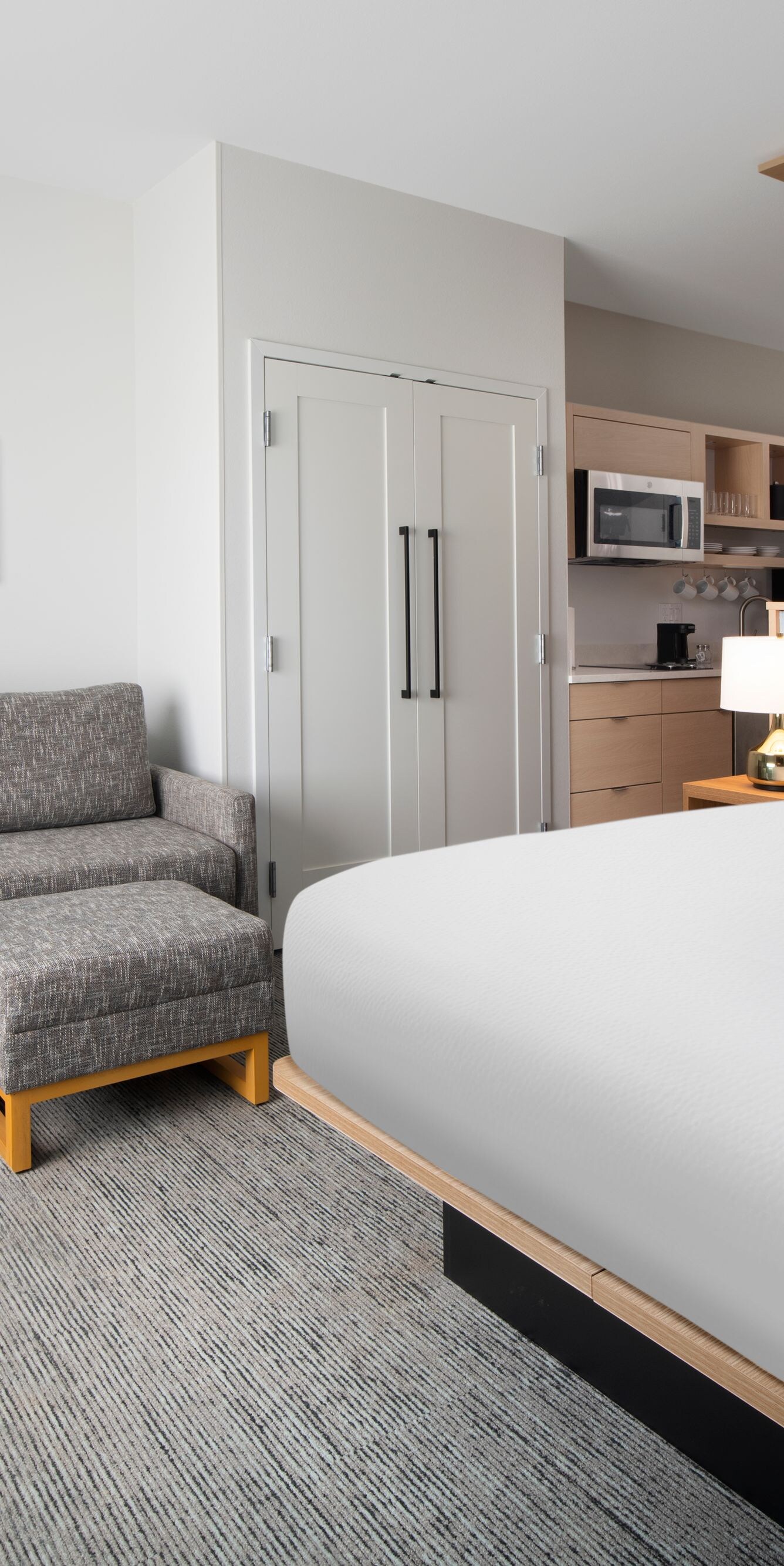 Studio suite with king bed, sofa, and kitchenette