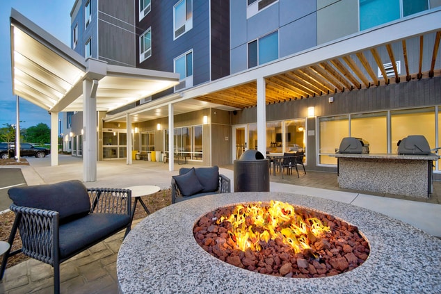 Outdoor patio with fire pit and grills