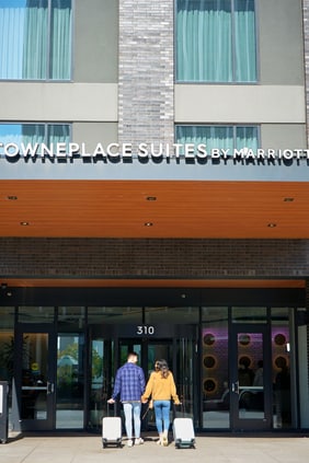 Front of hotel with guests entering