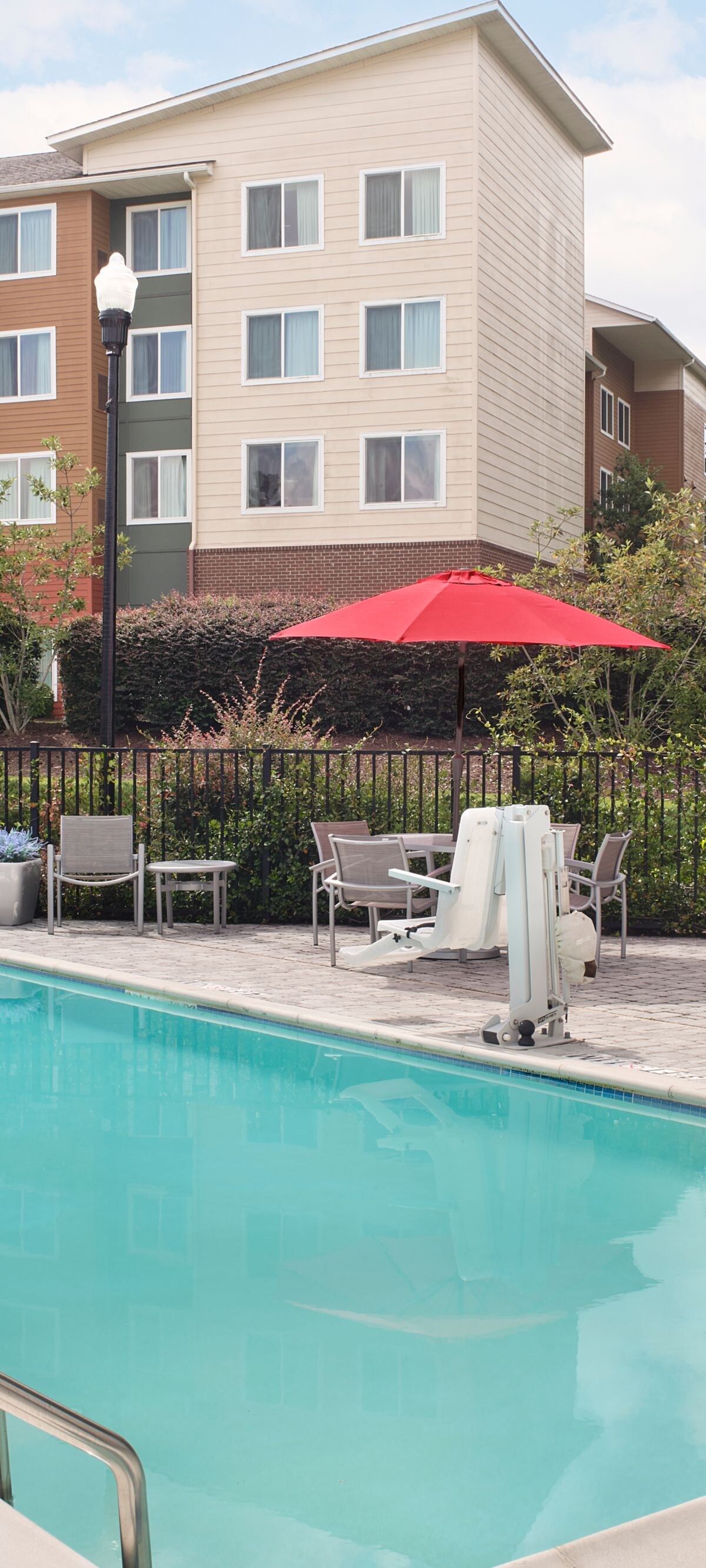 Accessible outdoor pool with lounge seating