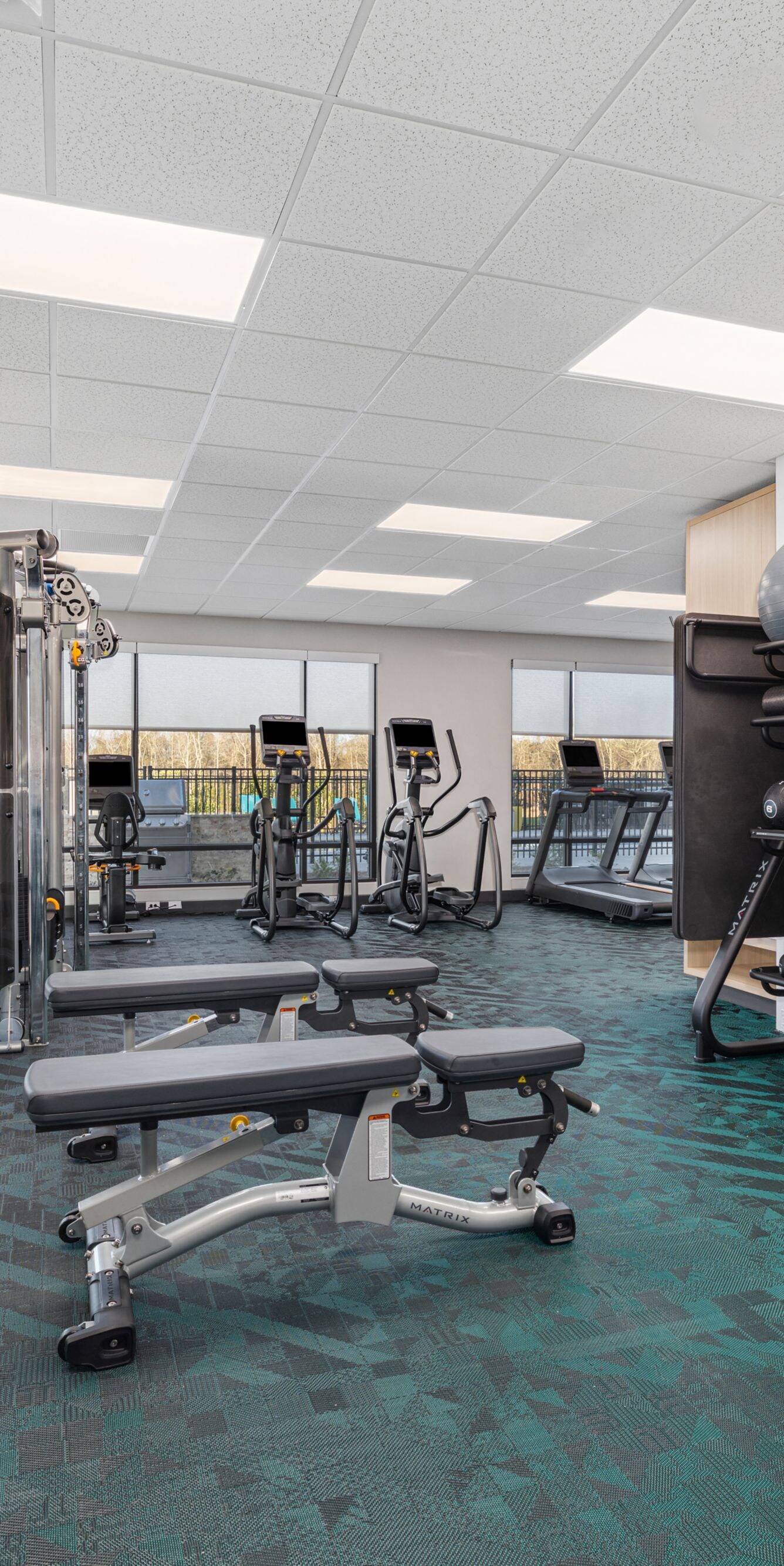 Fitness center cardio equipment and weights