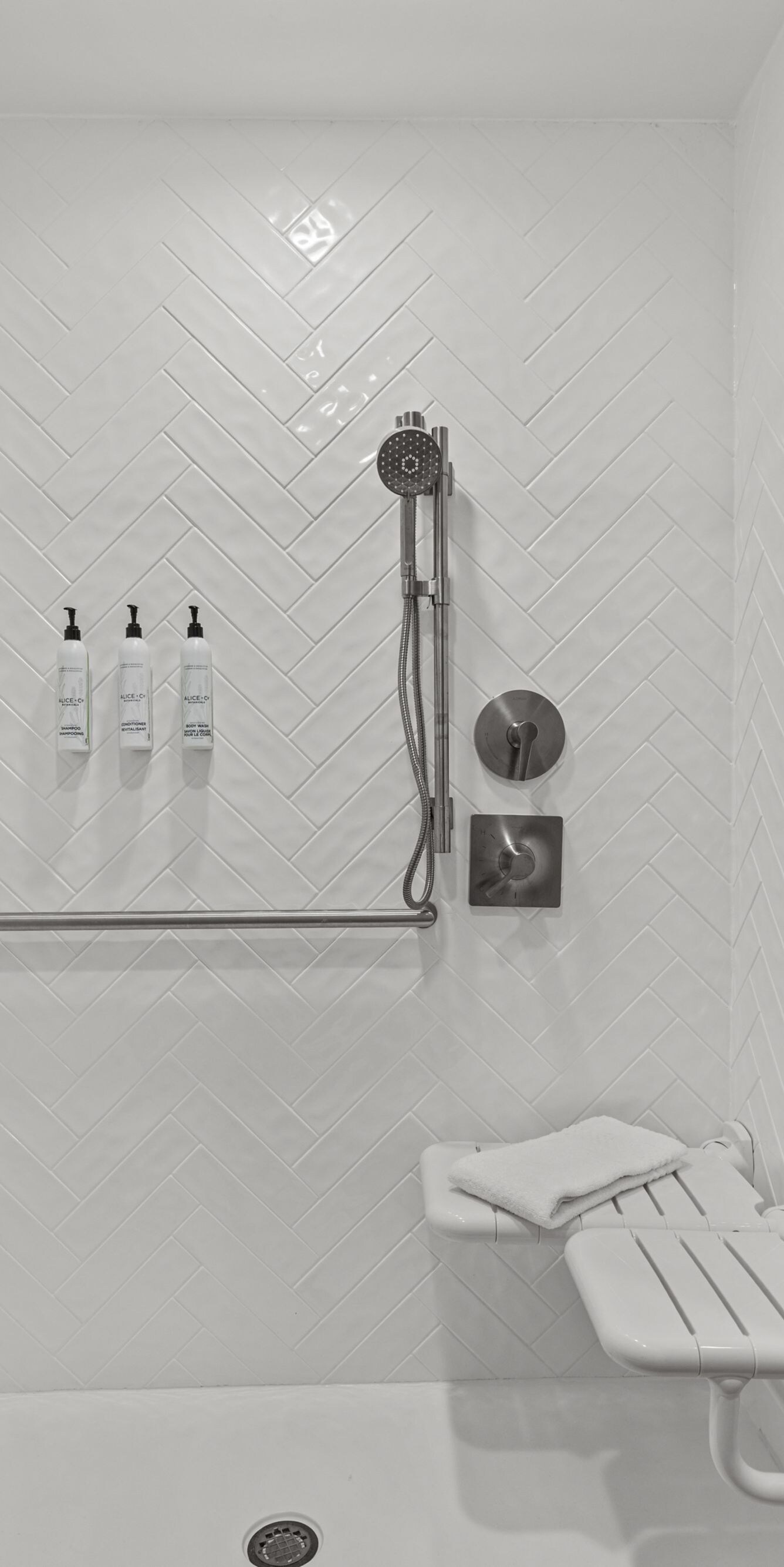 Accessible guest bathroom with roll‑in shower