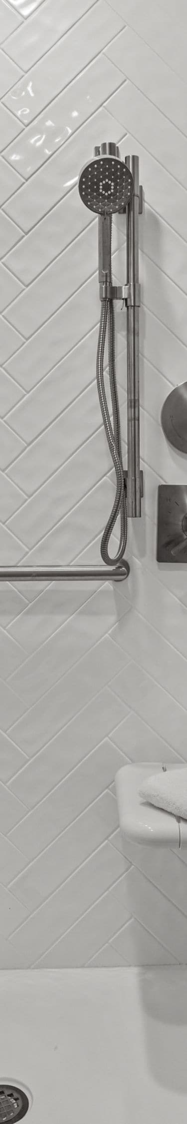 Accessible guest bathroom with roll‑in shower