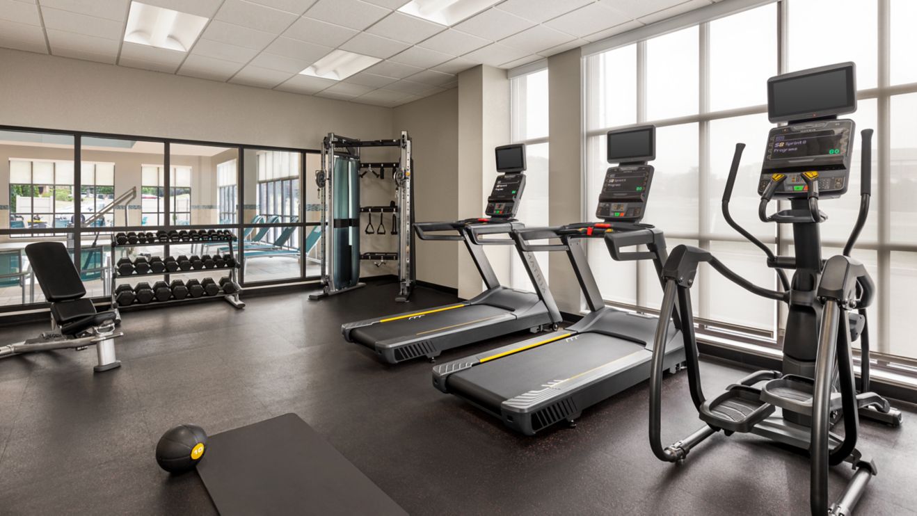 Guest fitness center with free weights & machines
