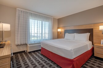 Imagen de una cama tamaño King en la suite de dos dormitorios