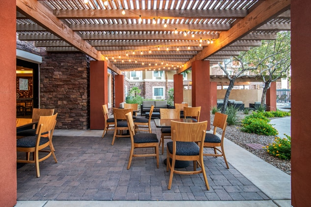 Outdoor breakfast area featuring tables and chairs