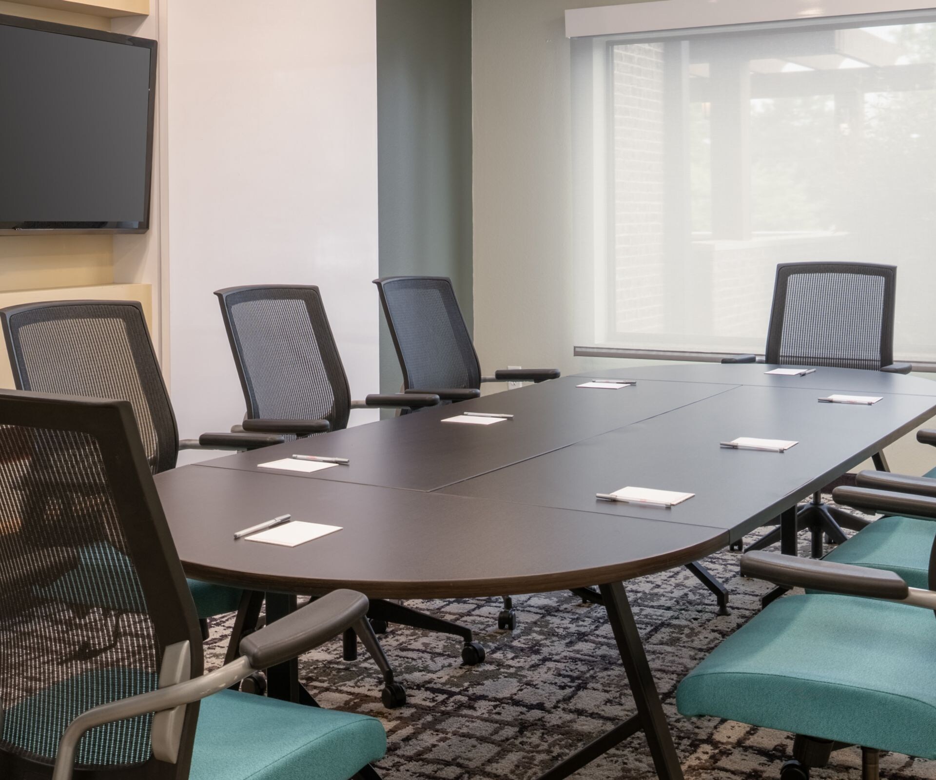 Meeting room with conference table and chairs