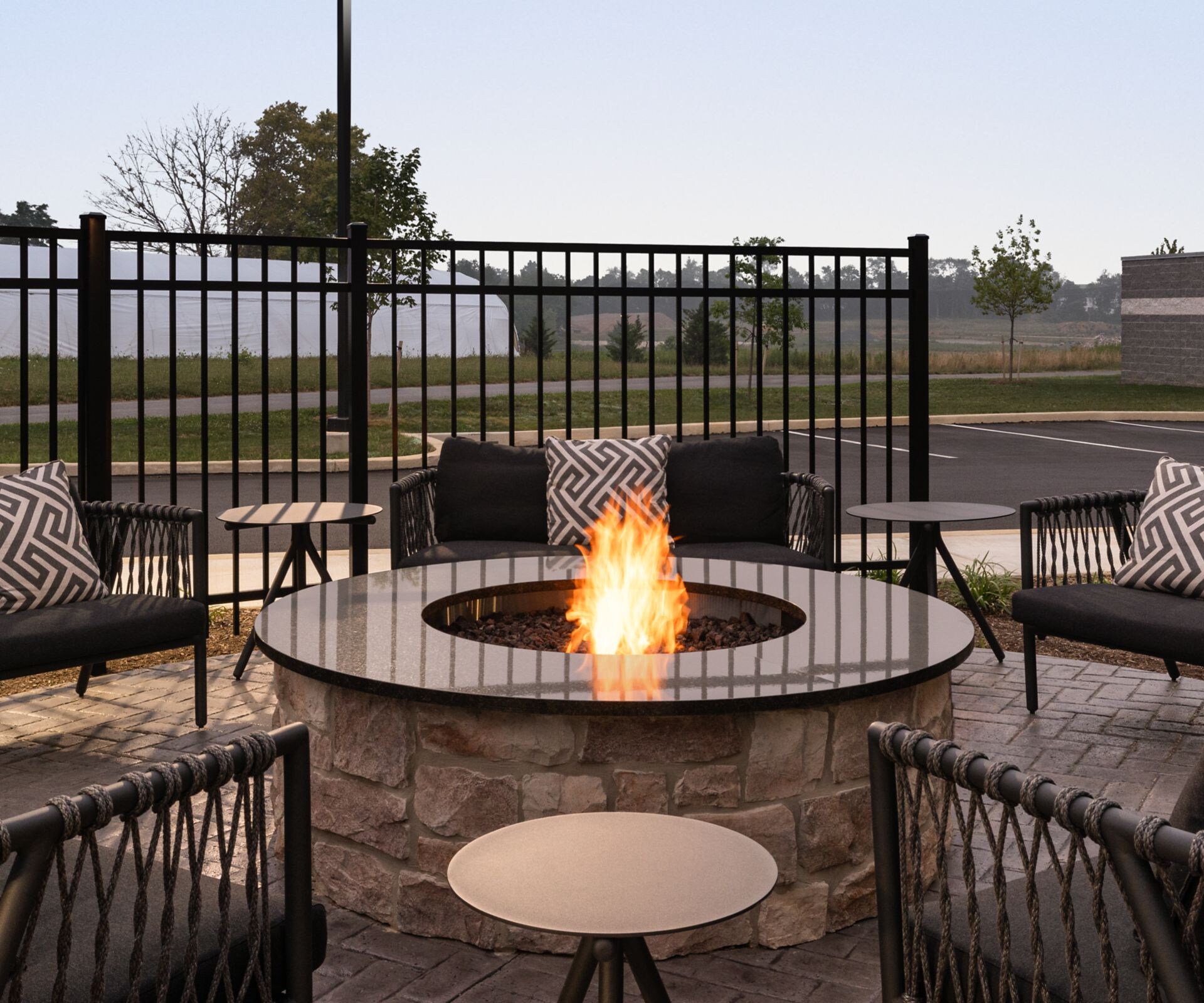 outdoor fireplace with comfy chairs