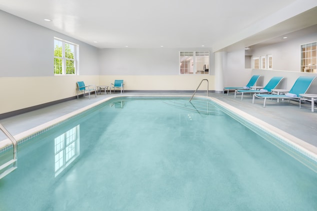 Indoor heated pool and lounge chairs