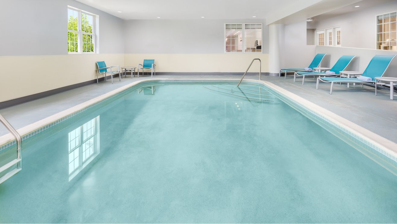 Indoor heated pool and lounge chairs
