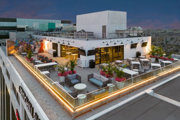 Seating Options with Lush Plants at Rooftop Bar