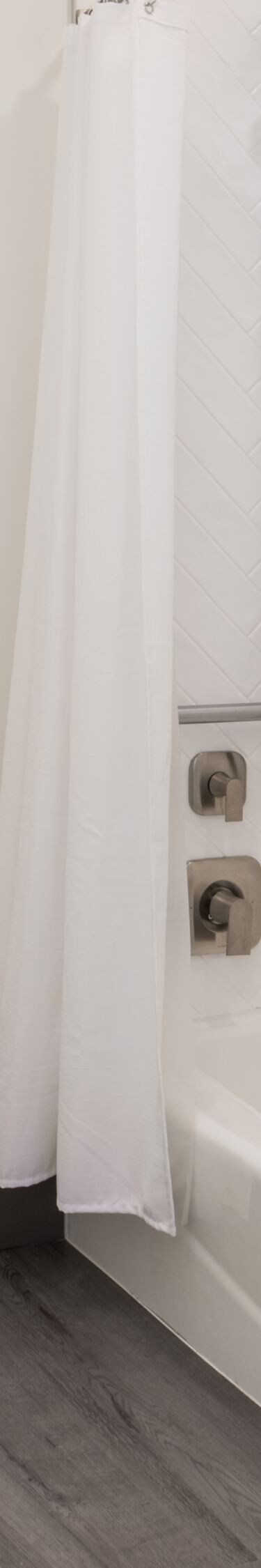 Accessible bathroom with tub and grab bars