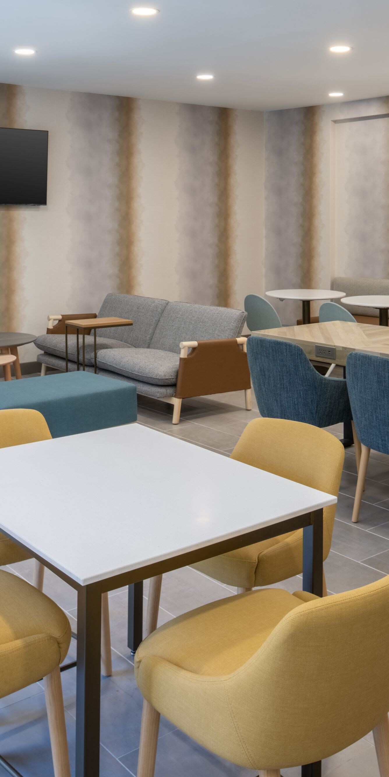 Breakfast Seating Area with chairs, tables and TV