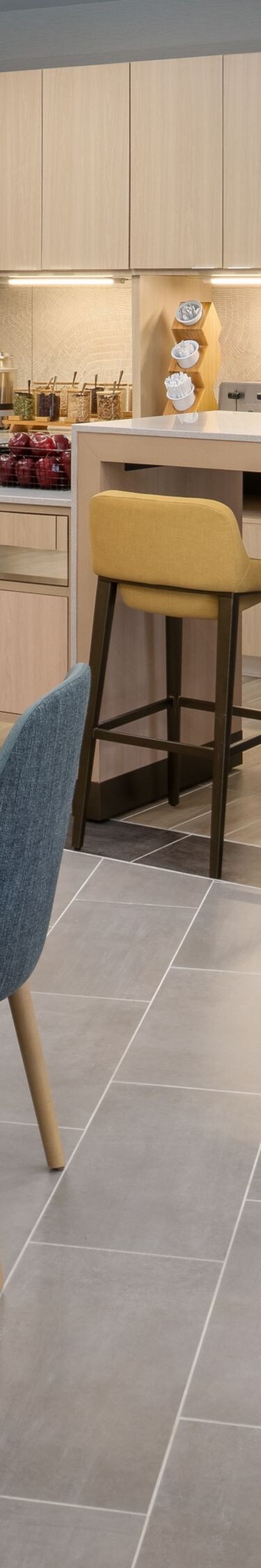 Breakfast seating area with food and coffee behind