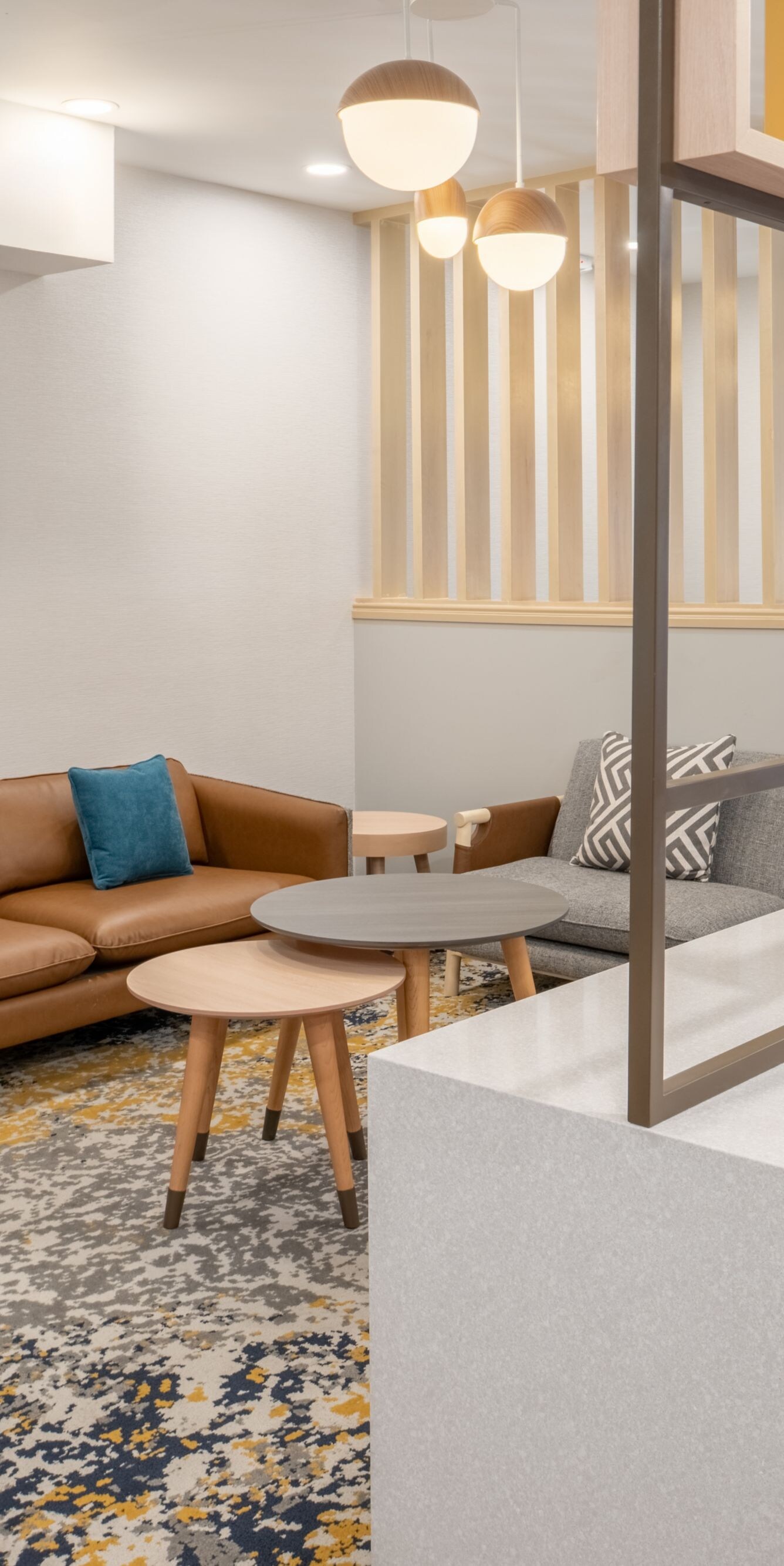 Lobby seating with couches, coffee tables, and TV