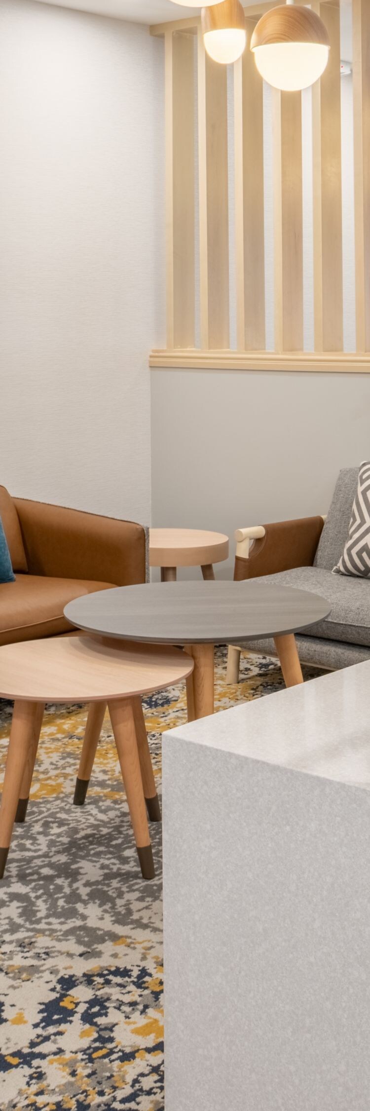 Lobby seating with couches, coffee tables, and TV