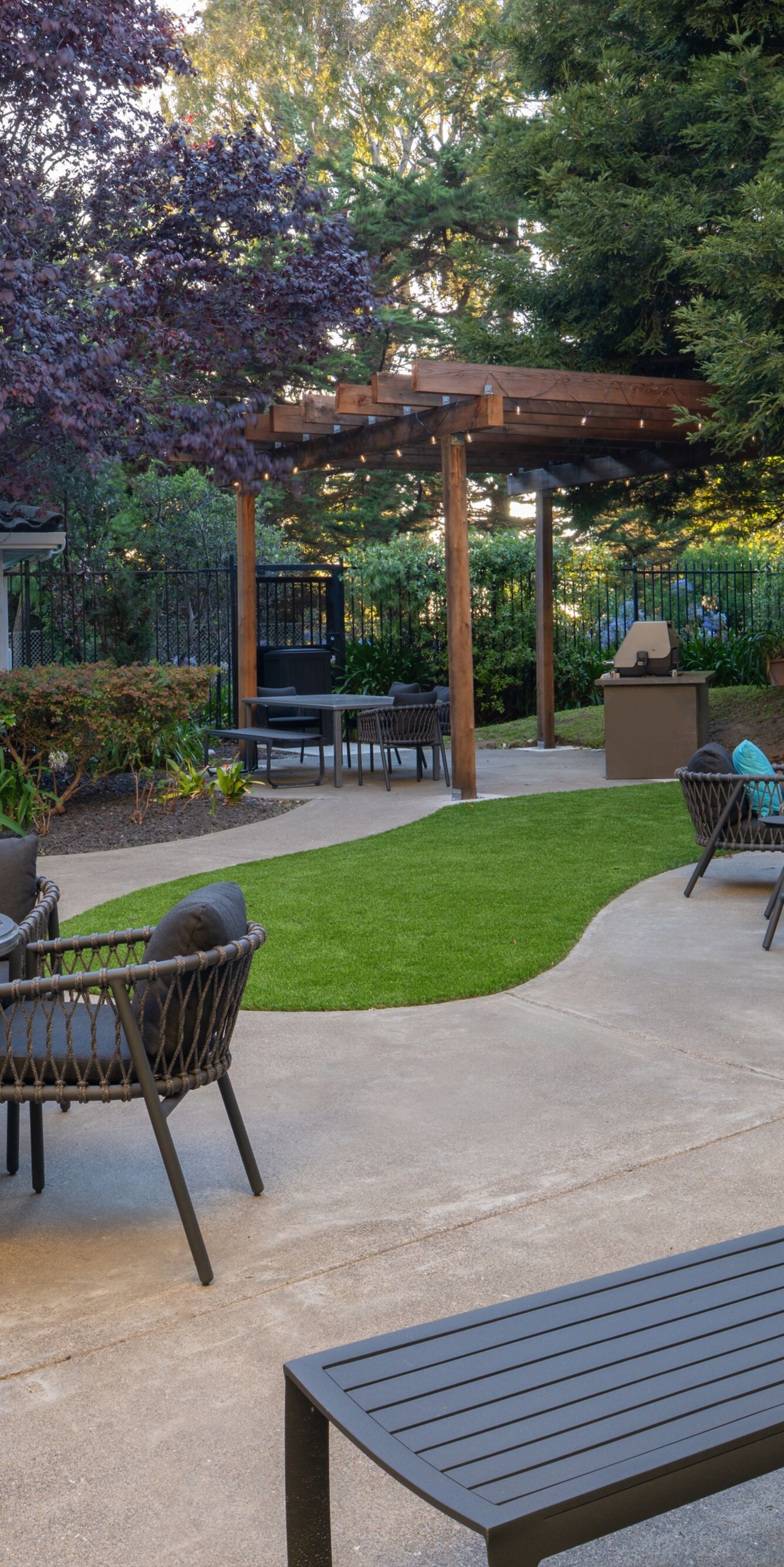 Public Patio with a fire pit and grill