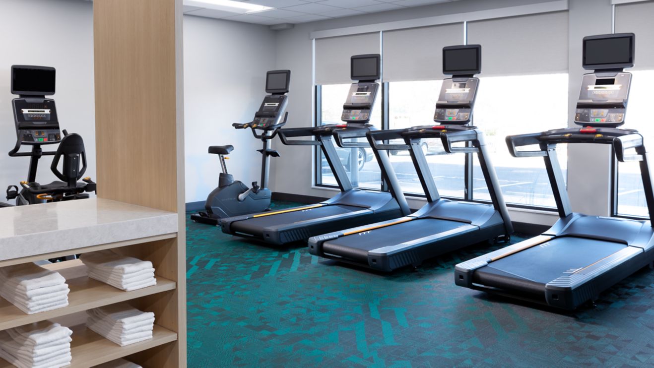cardio machines and treadmills for guests' workout