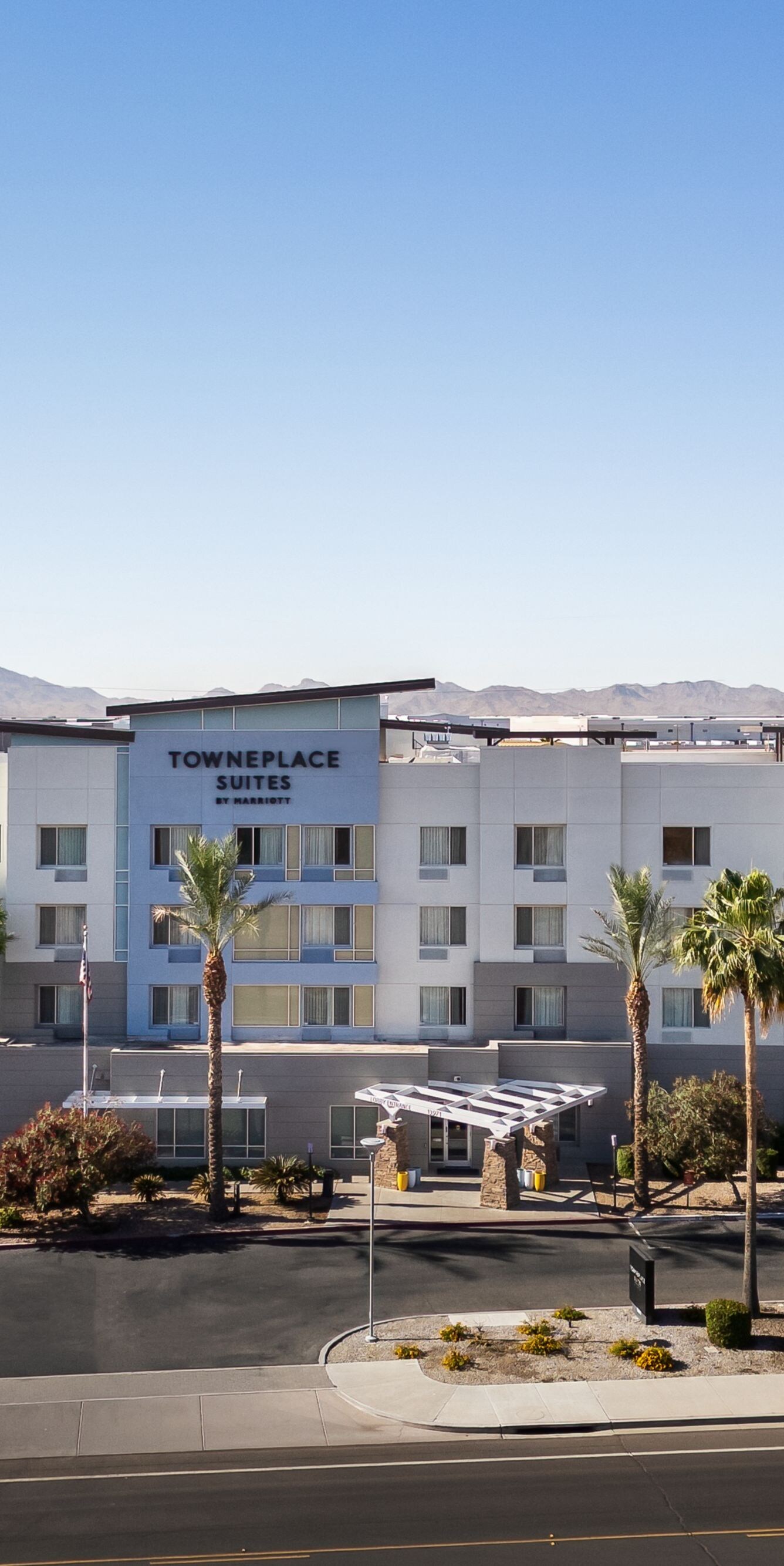 Hotel Exterior at daytime with blue skies 