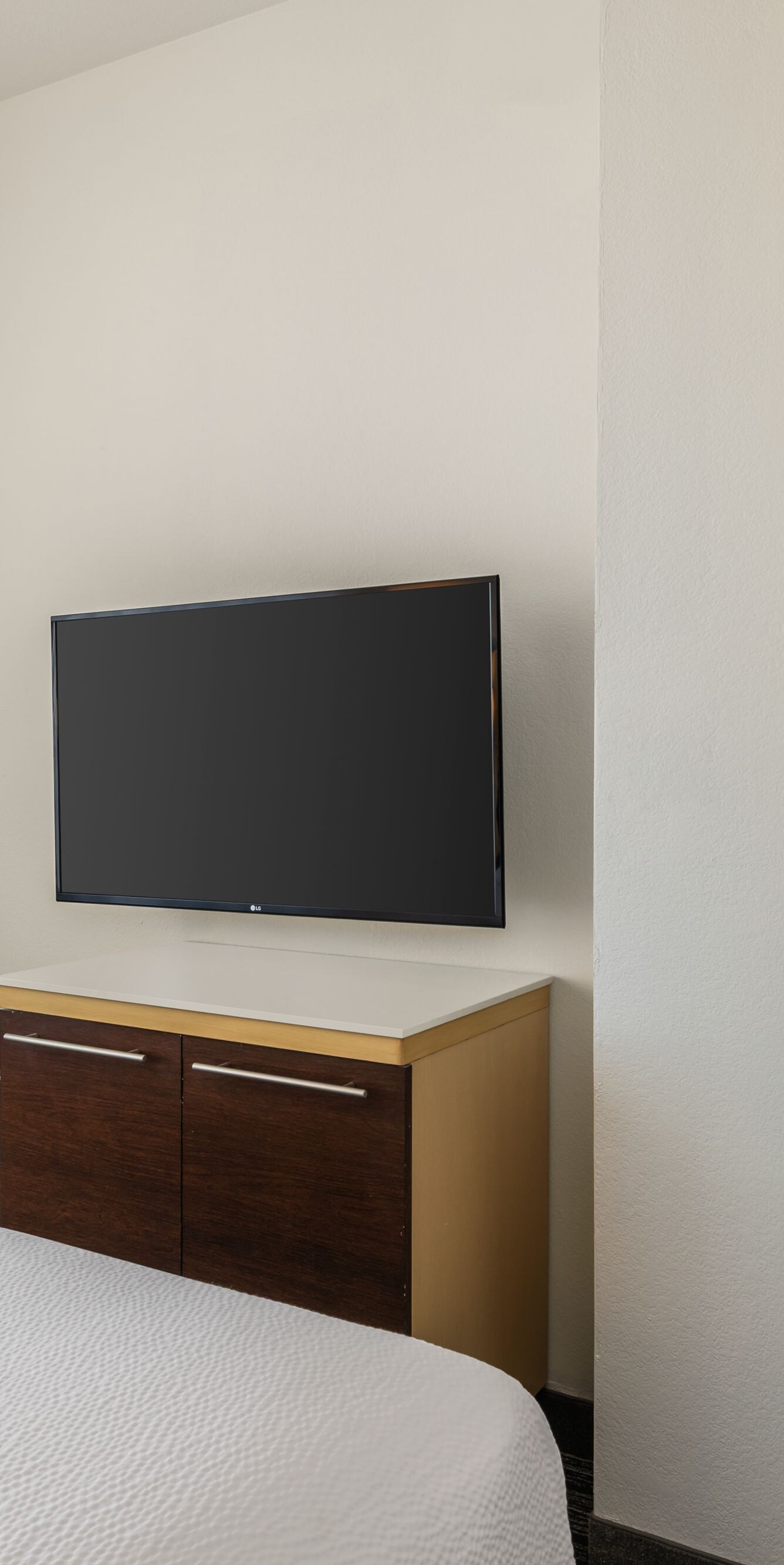 bed with tv and storage area